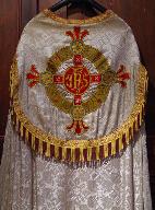 Application sur textile Art déco de croix sur cercle (Croisade eucharistique ?)